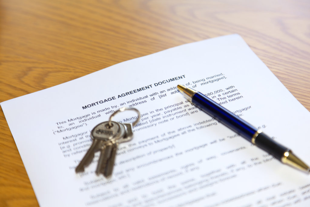 Mortgage document, pen and keys
